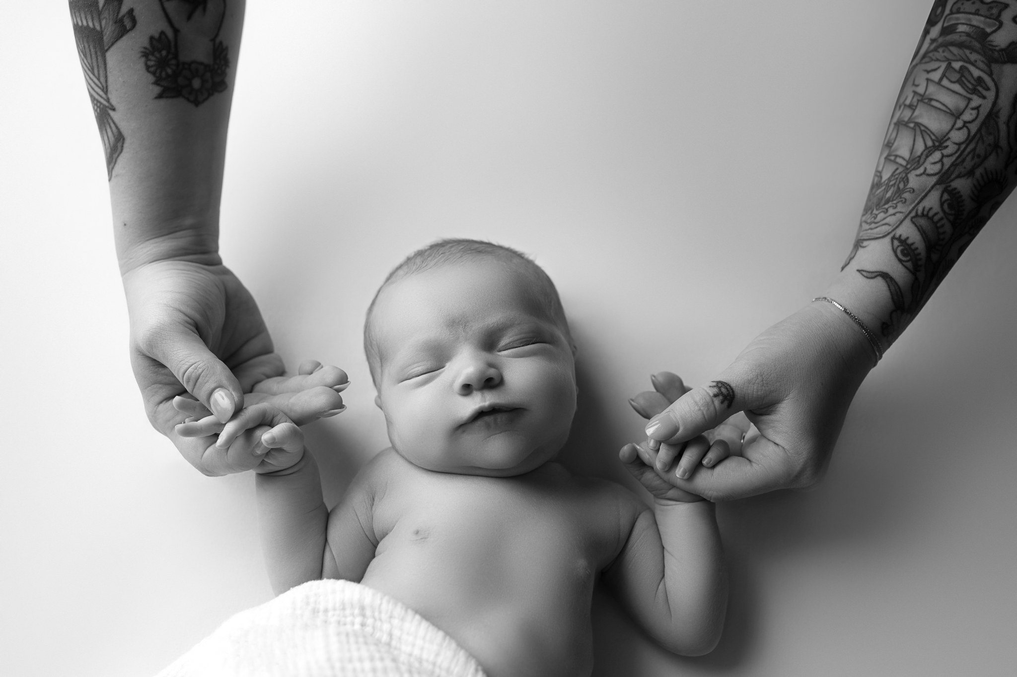 black white newborn hand photo austin